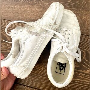 Woman’s white Vans